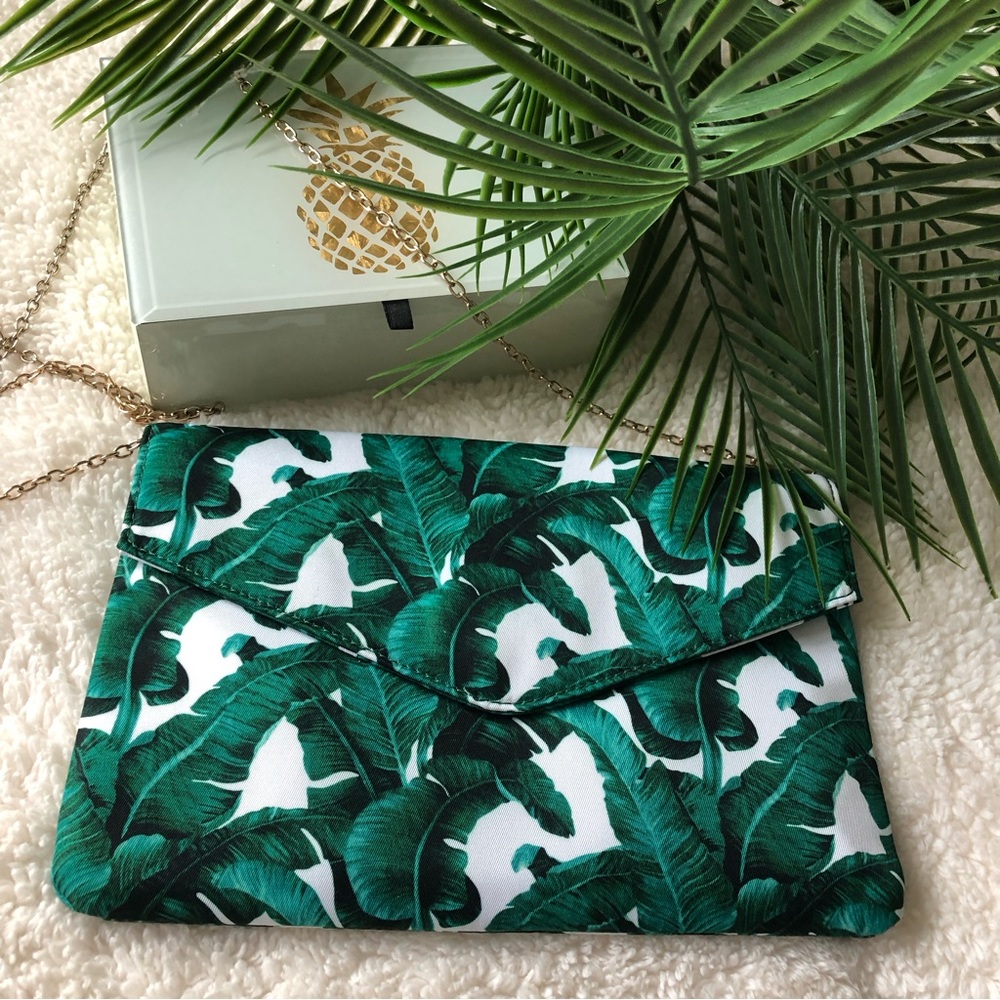 New. Never used. Palm print flat crossover bag